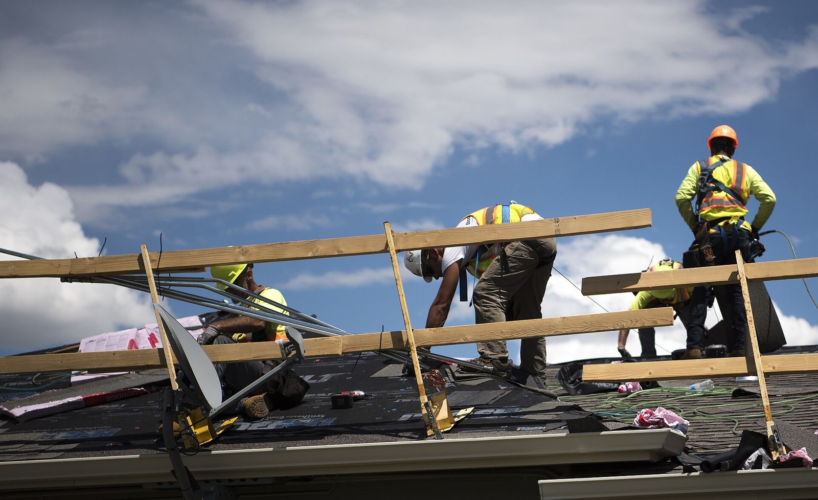 Elm Street crew setting decking on a roof in Plainfield
